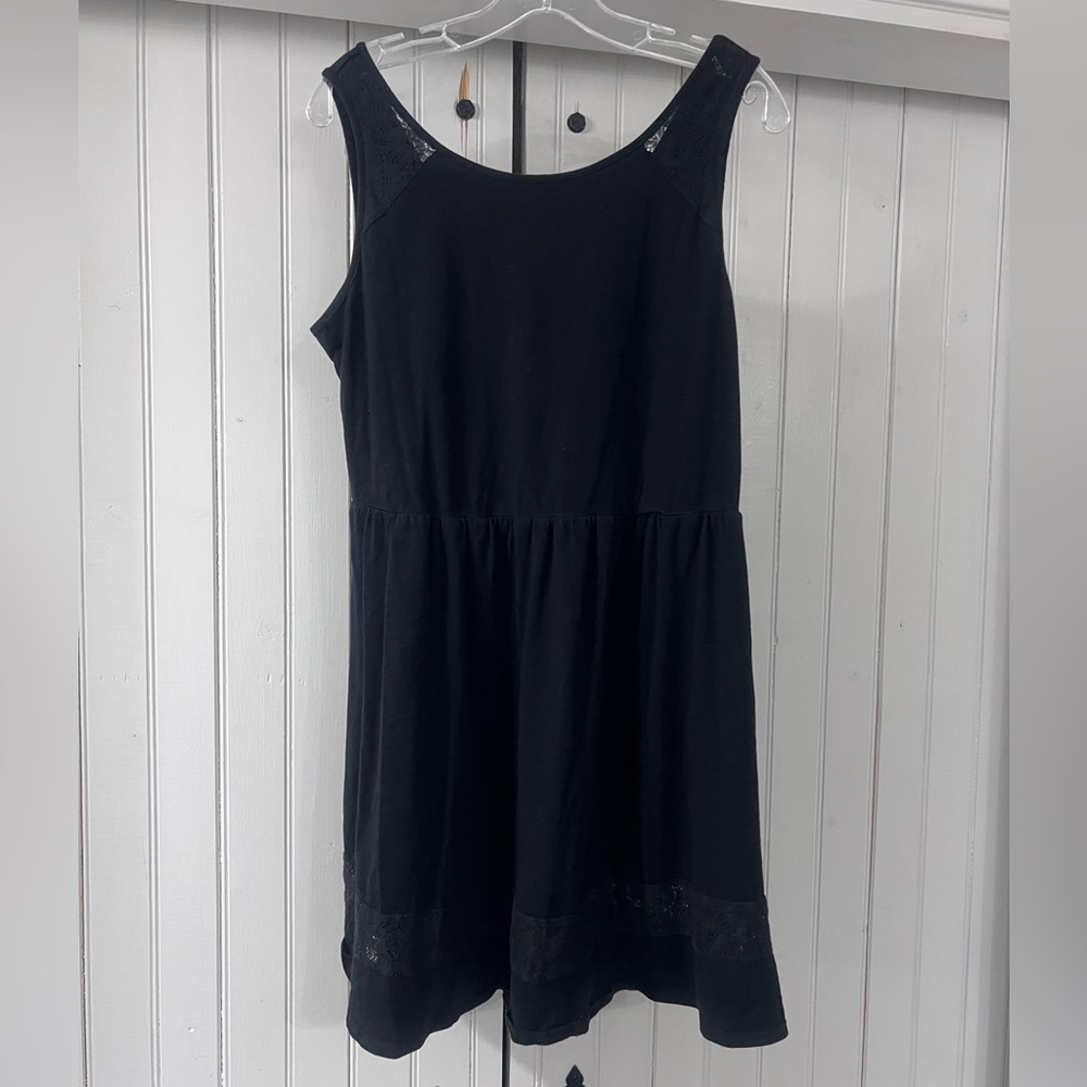 Black knee length cotton dress.